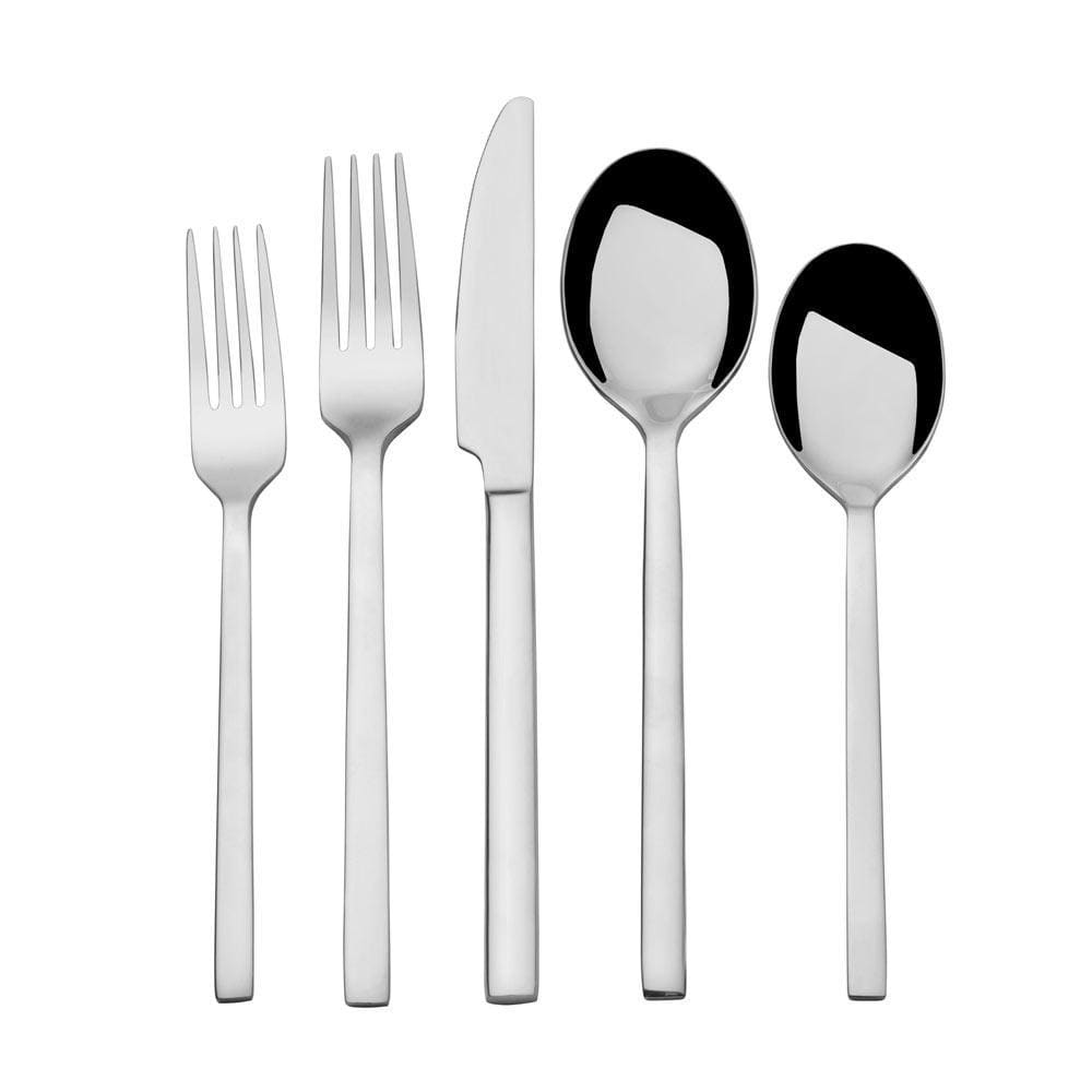 Flatware set for 4 persons arranged on a dinner table, shiny and elegant