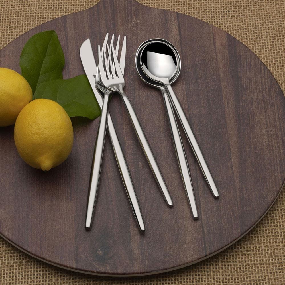 Elegant stainless steel silverware for 4 people at dinner table