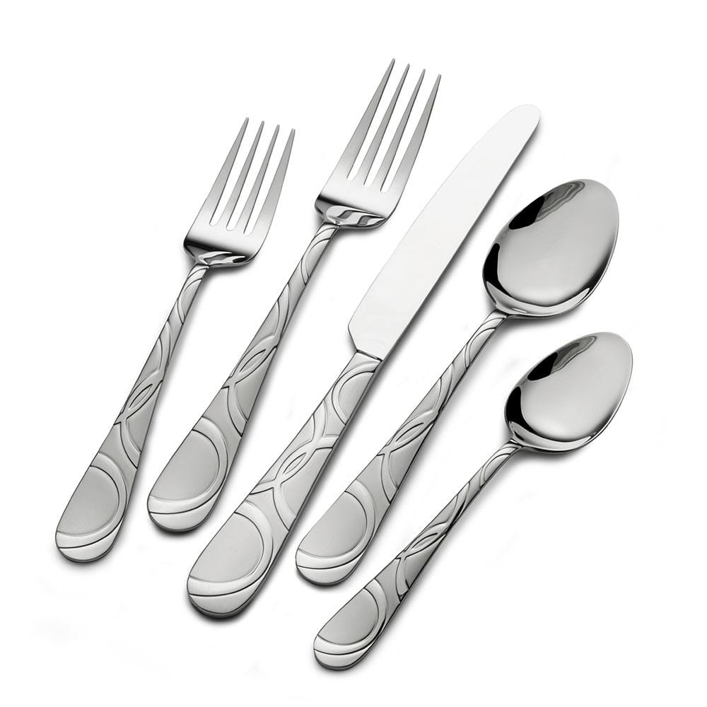 Set of flatware for 8 people arranged on a dining table
