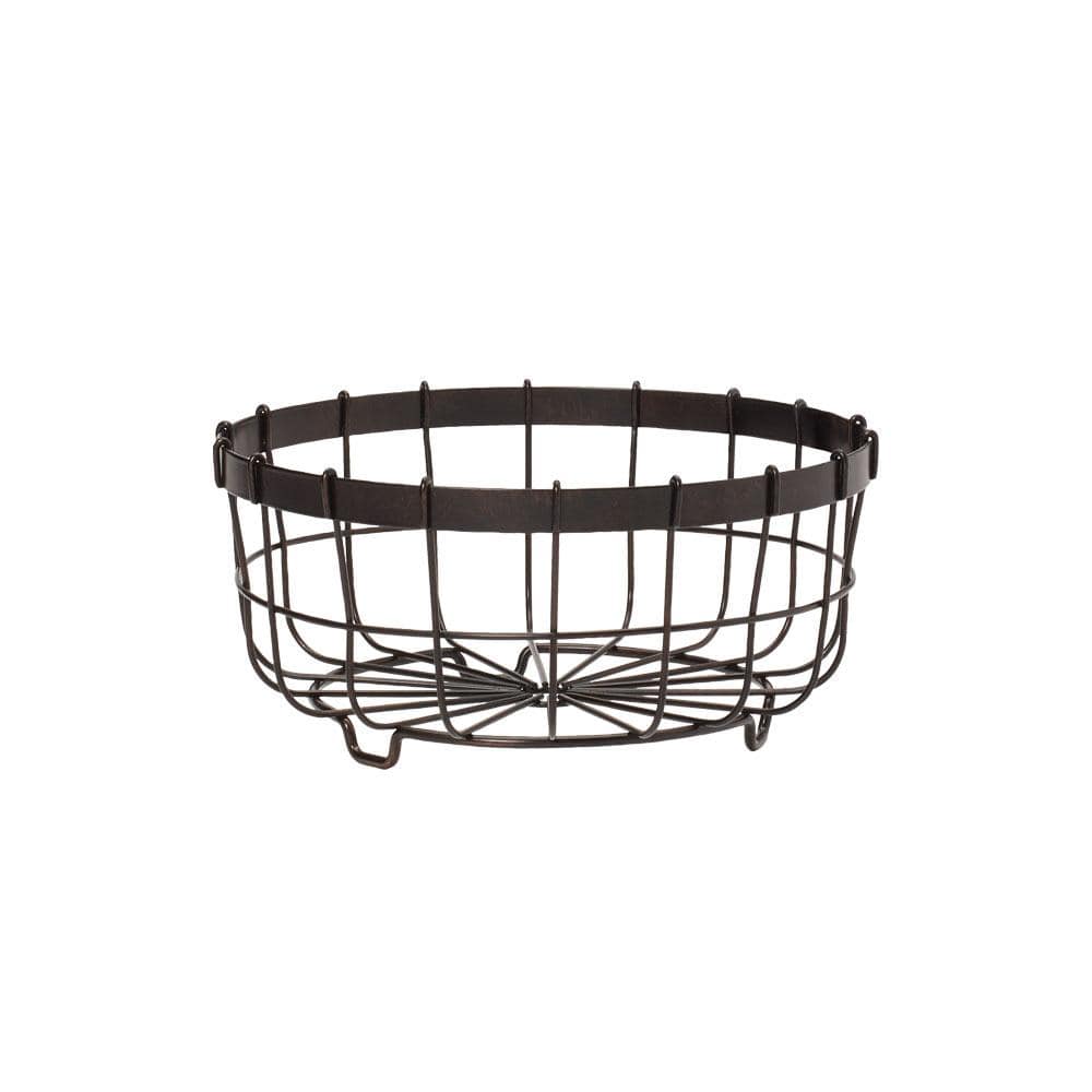Wrought iron fruit basket with banana hanger displaying bananas and apples.
