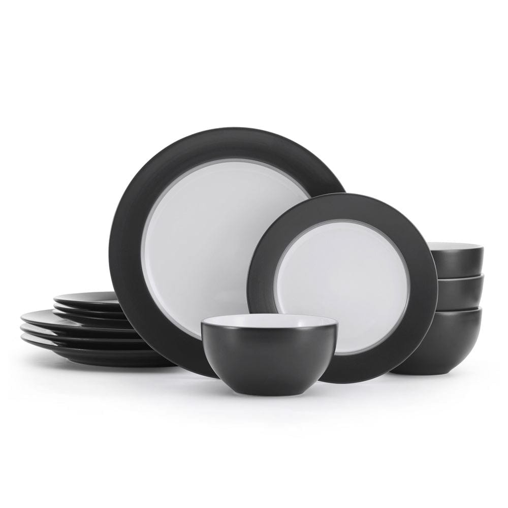 Set of four dinnerware plates, bowls, and salad plates on a modern table