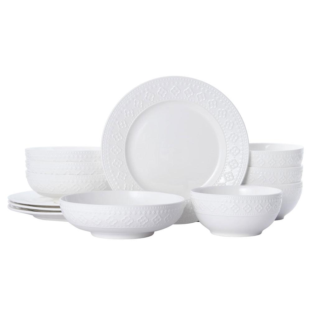 Set of 12 dinnerware pieces including plates and bowls for formal dinners