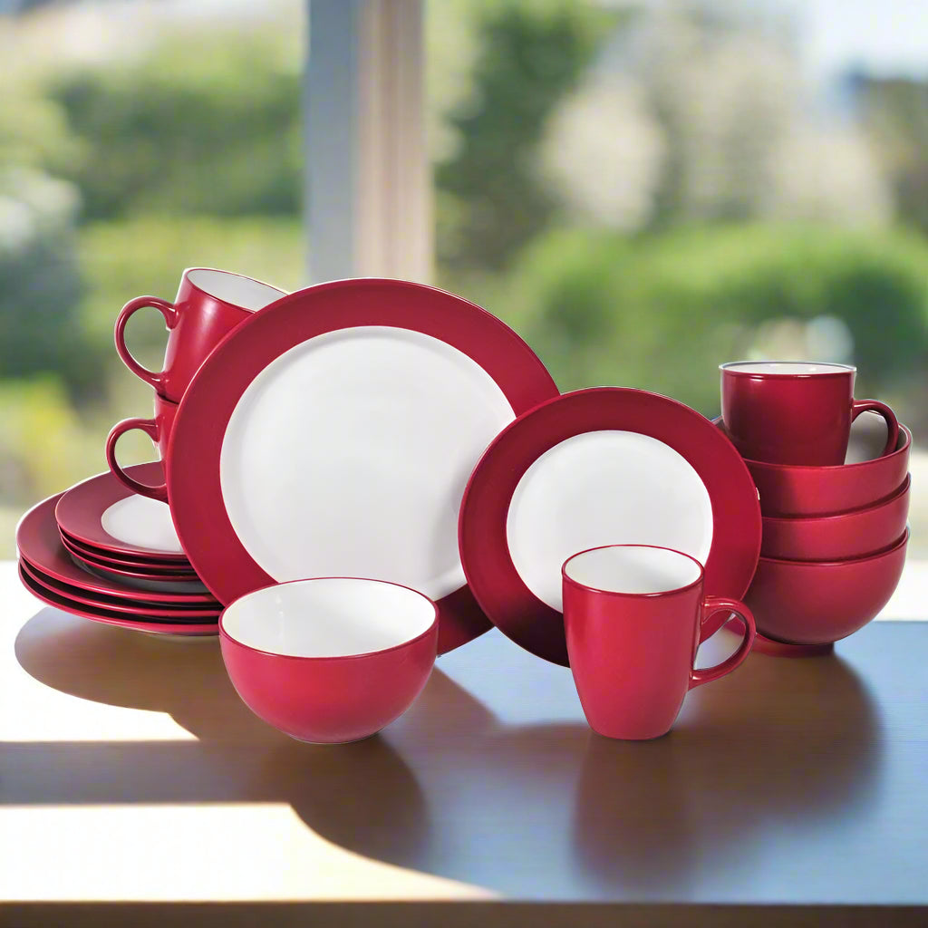 Harmony Red stoneware dinner plates set on a dining table, ideal for family meals.
