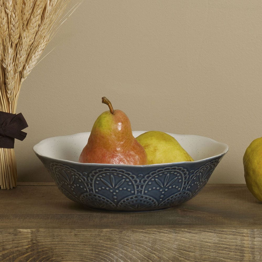 Angle view of handcrafted embossed blue serving bowl, perfect for parties and gatherings.