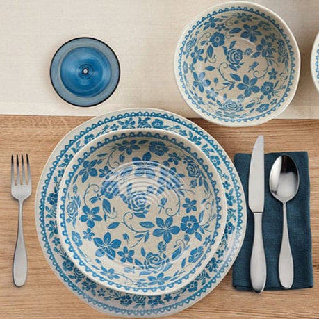 Elegant Hayden Blue bowls and plates stacked, showcasing organic shapes and craftsmanship
