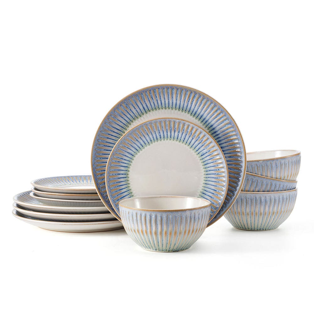 Set of Hensley Blue stoneware dinner plates, salad plates, and bowls on a dinner table