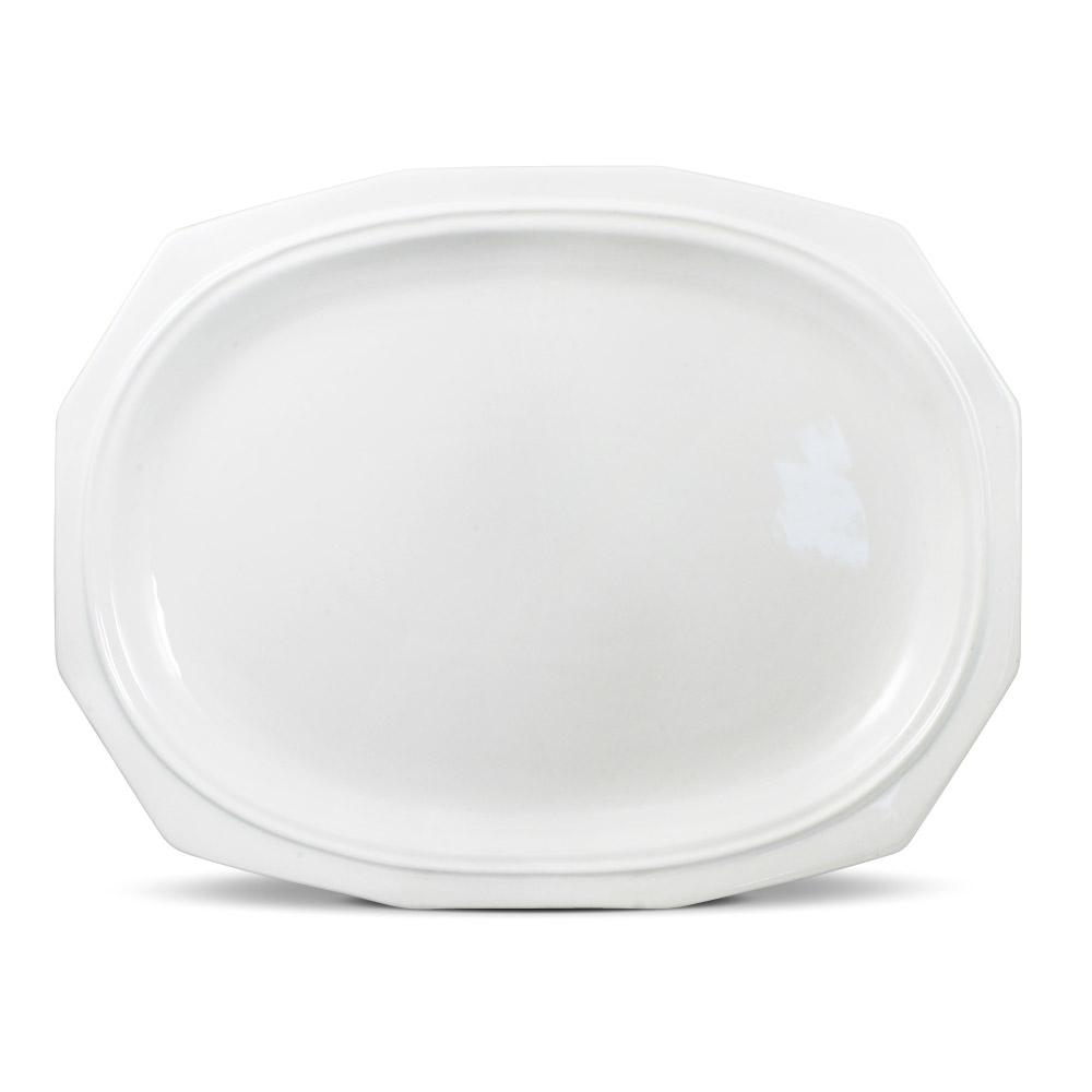 Large oval platter filled with grilled meats and sides