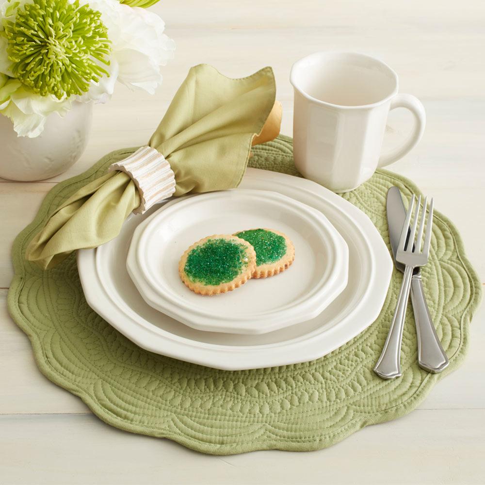 Top view of ceramic salad plates with a fresh salad inside