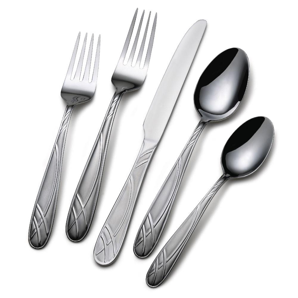 Hoopla Frost flatware set displayed elegantly on a dining table.