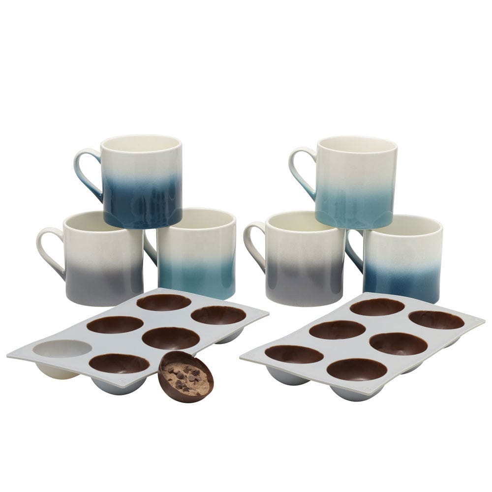 Deluxe hot chocolate bomb kit with colorful mugs and silicone molds for making hot chocolate bombs.