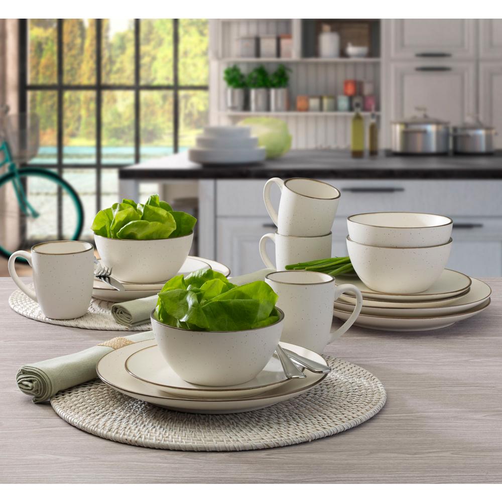 Stacked dishwasher safe dinnerware for four in modern kitchen