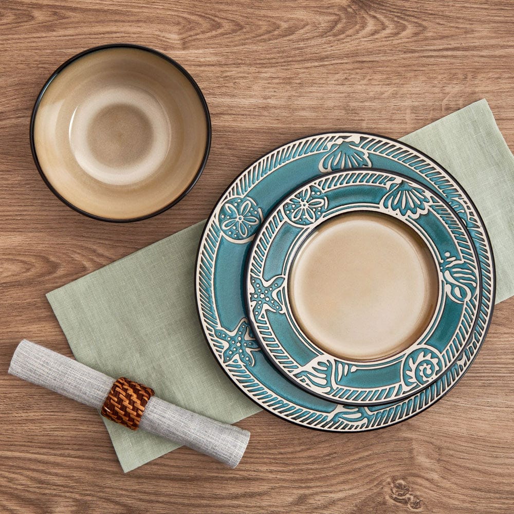 Close-up of the embossed seashell design on the stoneware dinner plate