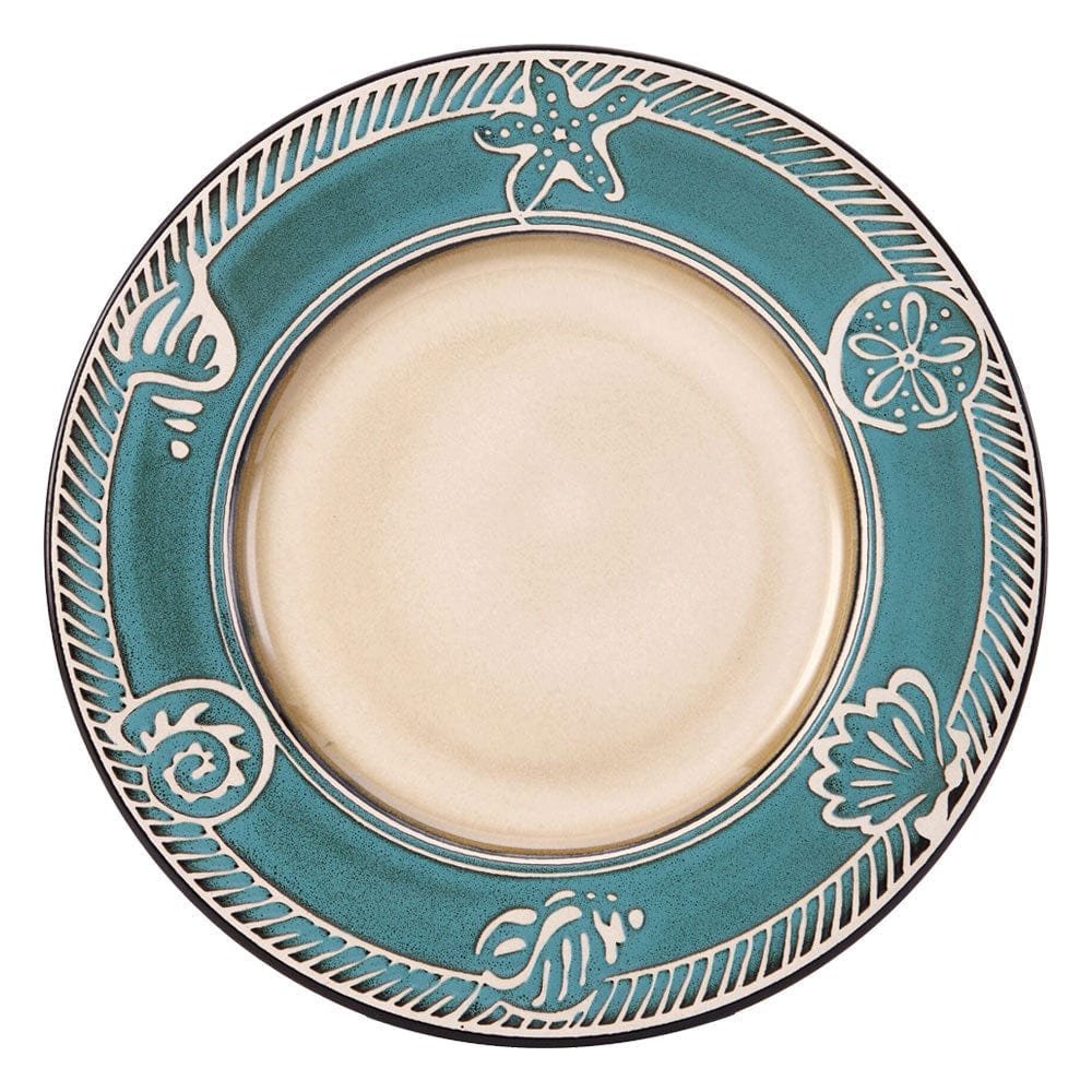 Close-up of the embossed seashell design on the stoneware dinner plate
