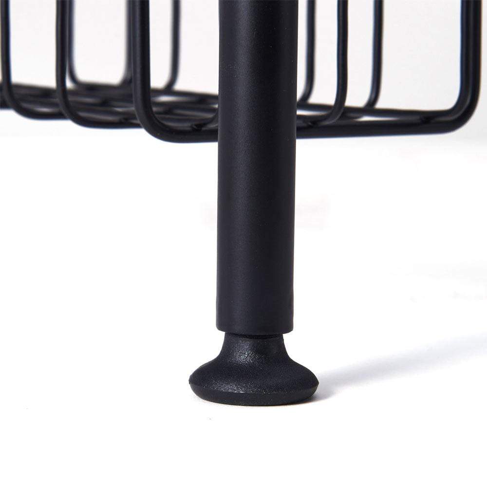 Multi-tier kitchen sink organizer in use, drying dishes and storing cleaning supplies.