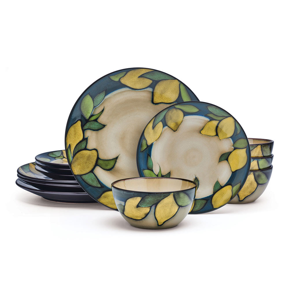 Set of stoneware dishes with vibrant lemon pattern on dining table