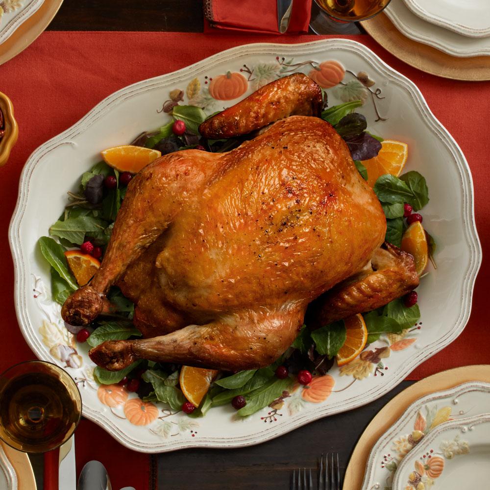 Large oval ceramic platter with a glossy finish, ideal for holiday meals