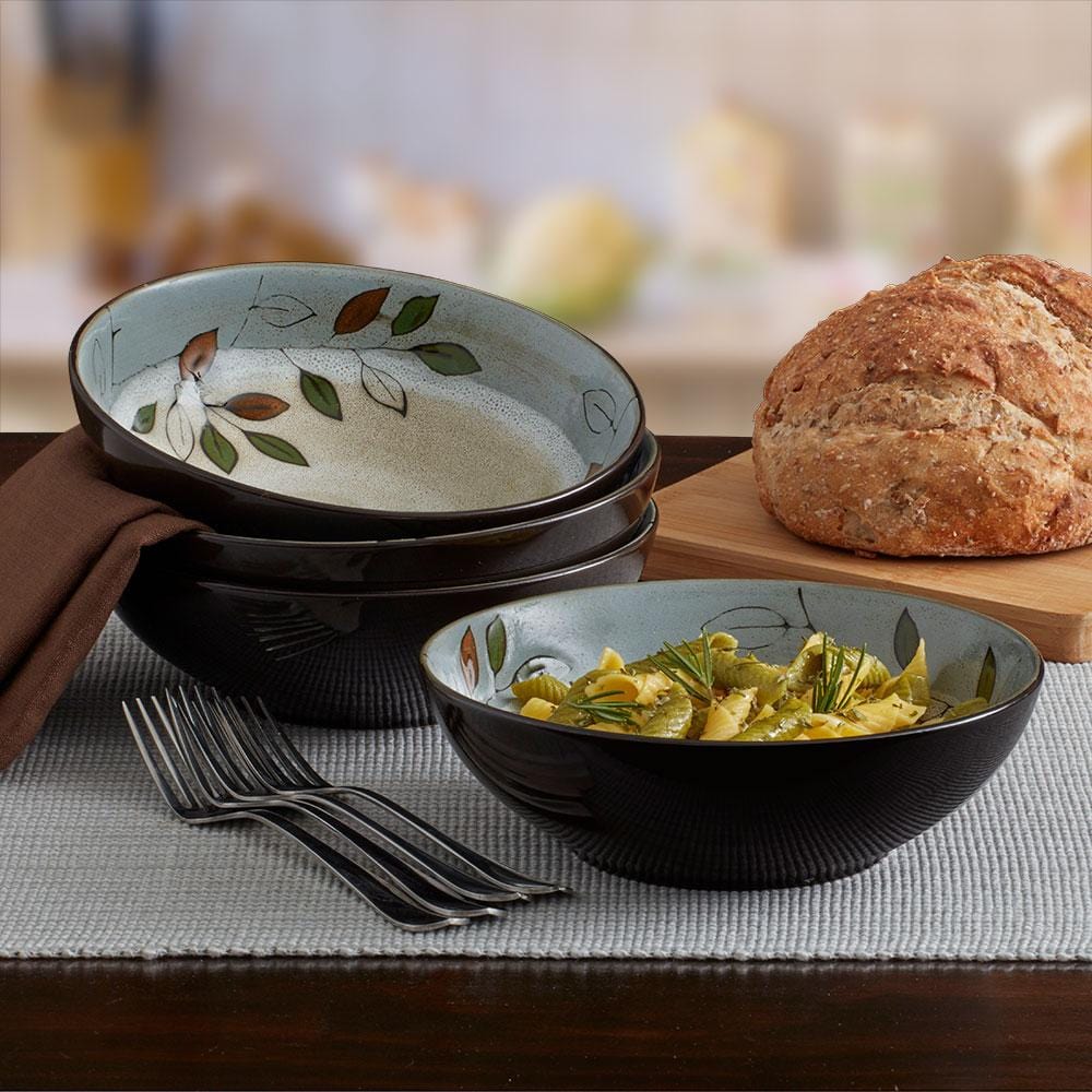 Close-up of rustic leaves reactive glaze pasta bowls with unique color variations