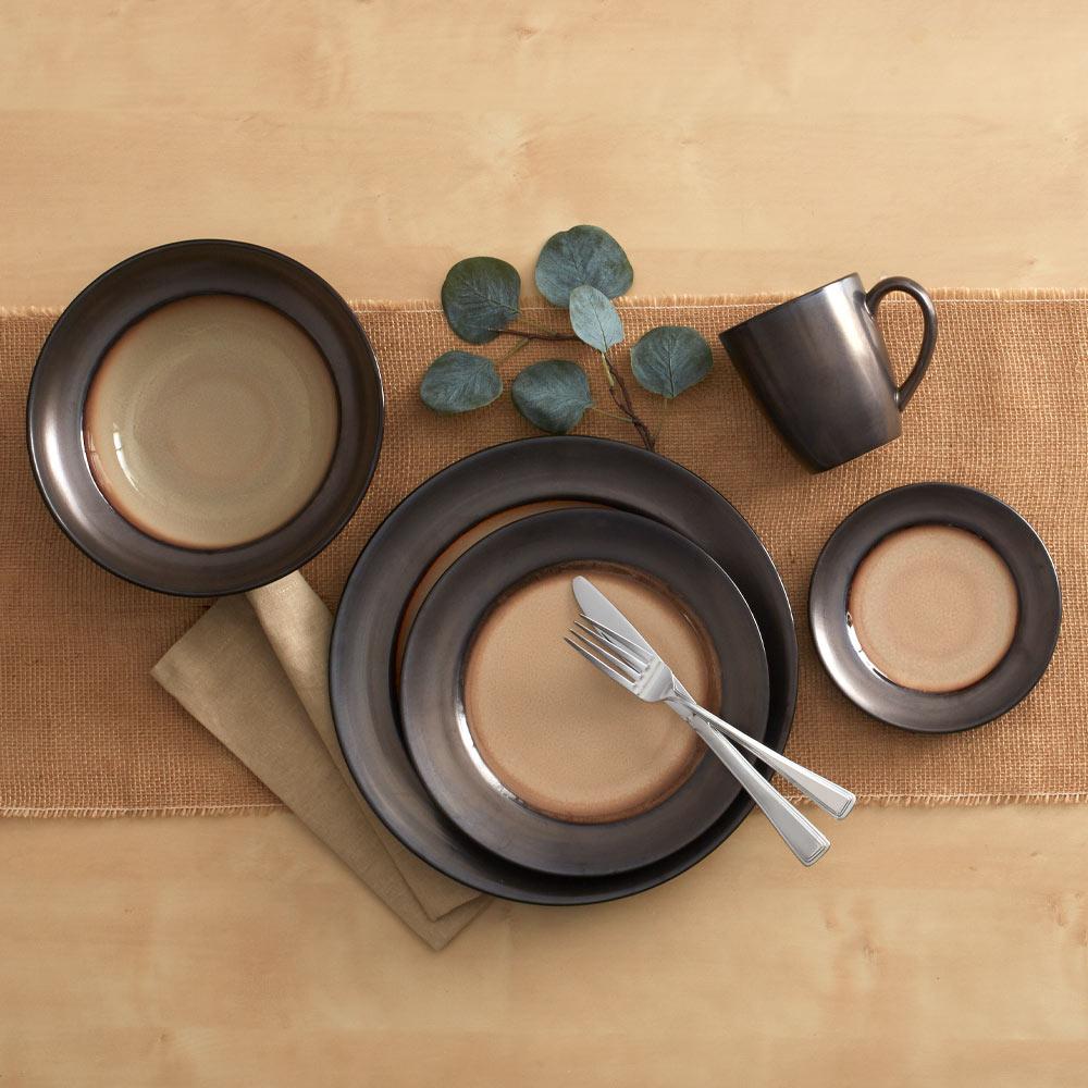 Rustic stoneware dinner plate showcasing unique reactive glaze patterns