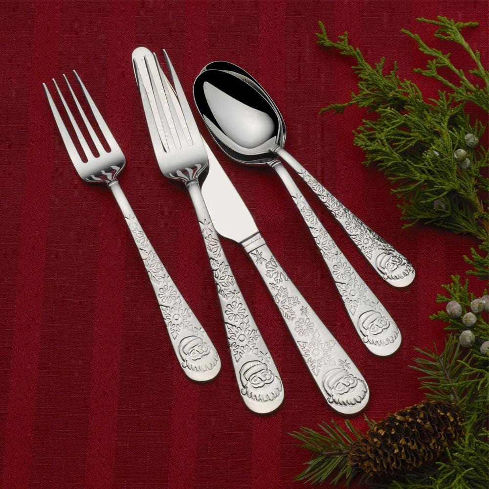 Elegant stainless steel dinner utensils with holiday-themed handles