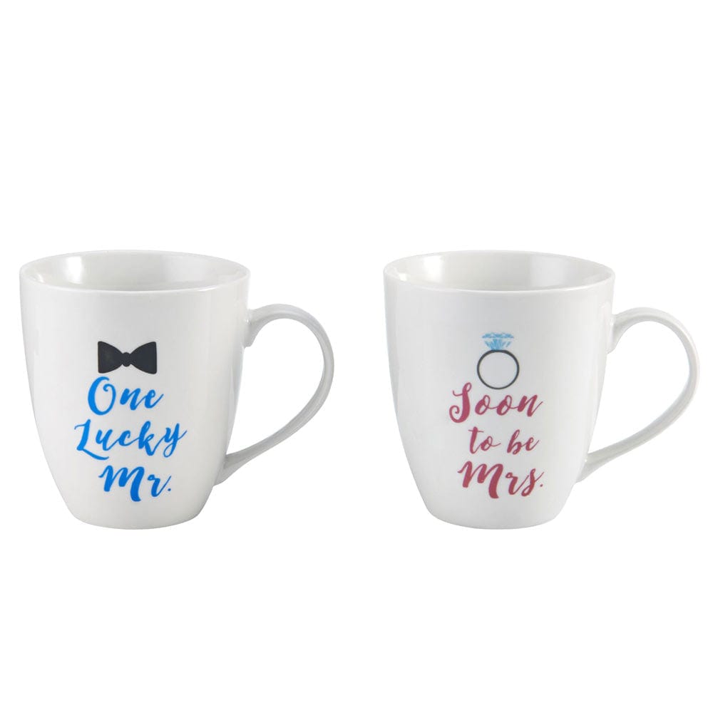 Close-up view of whimsical Mr and Mrs mugs featuring bow tie and engagement ring designs.