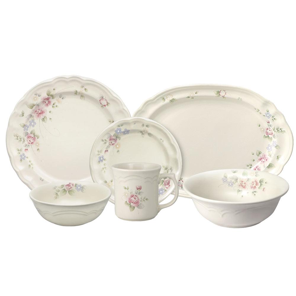 Close-up of the stoneware dishes in the Tearose dinnerware set, showcasing intricate designs.