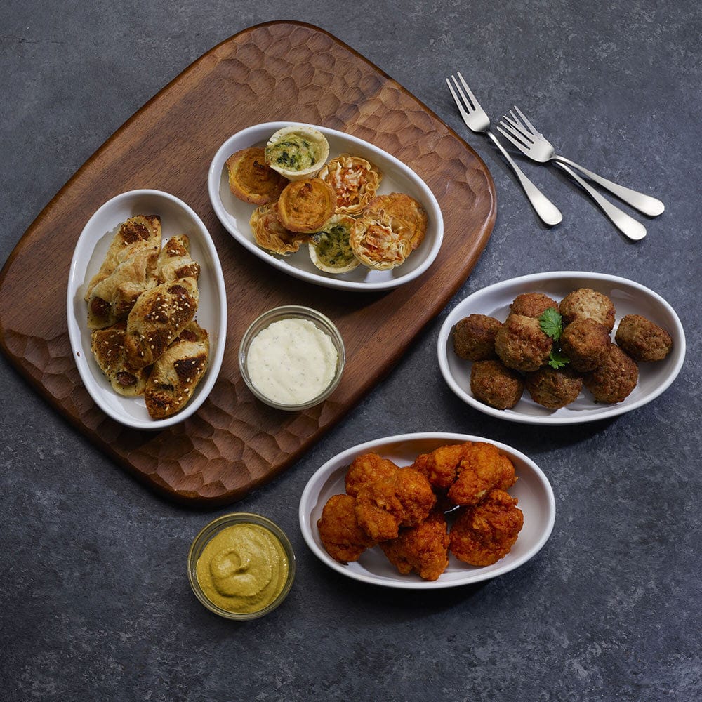 Elegant stoneware burrito bowl set displayed on a dining table, showcasing its sleek design.