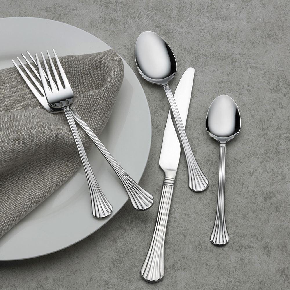 Close-up of scalloped stainless steel flatware for formal dining