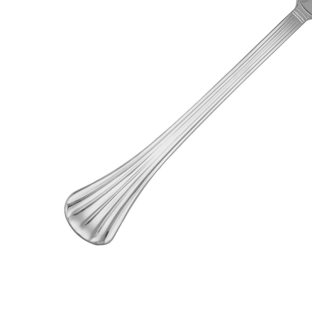 Close-up of scalloped stainless steel flatware for formal dining