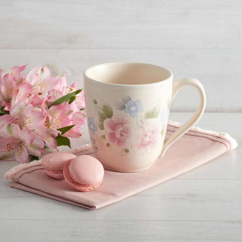 Large coffee mug in a cozy setting, microwave and dishwasher safe.