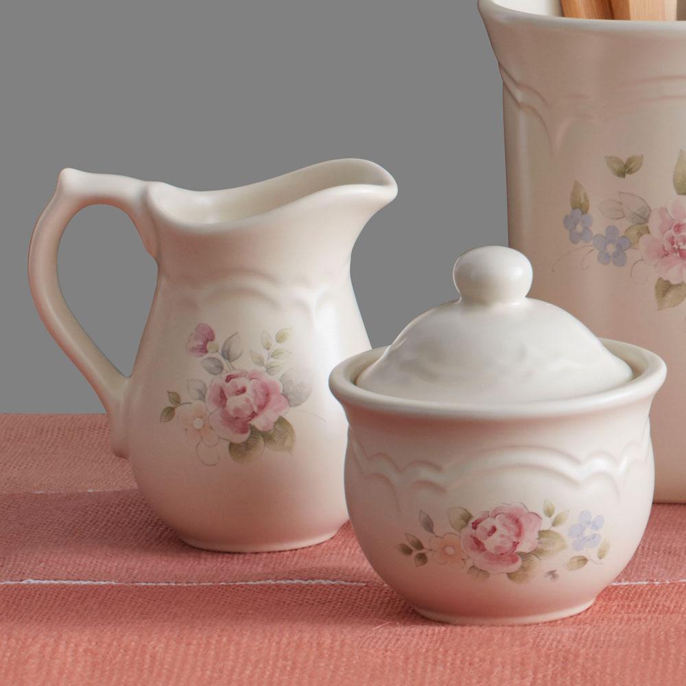 Close-up of the porcelain sugar and creamer set on breakfast table