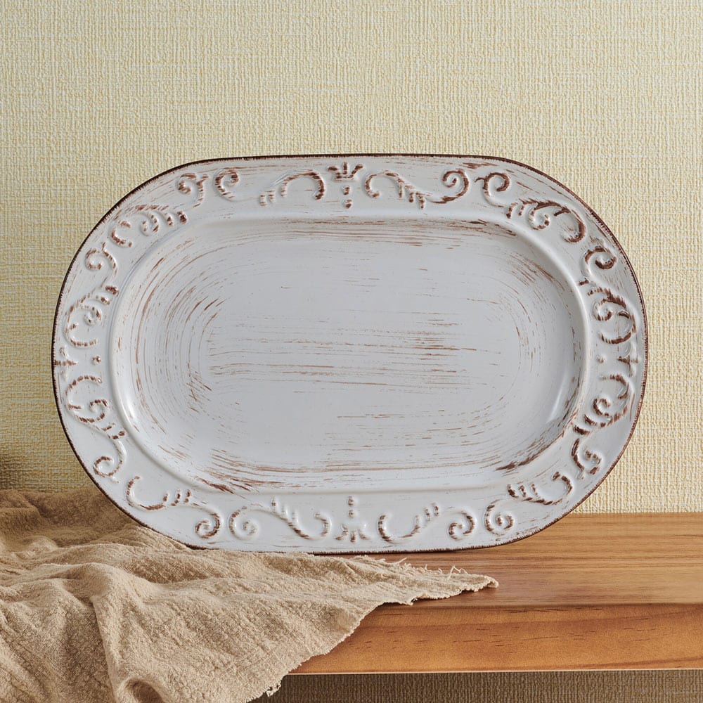 Elegant Trellis Stoneware Serving Platter showcasing subtle scroll patterns.