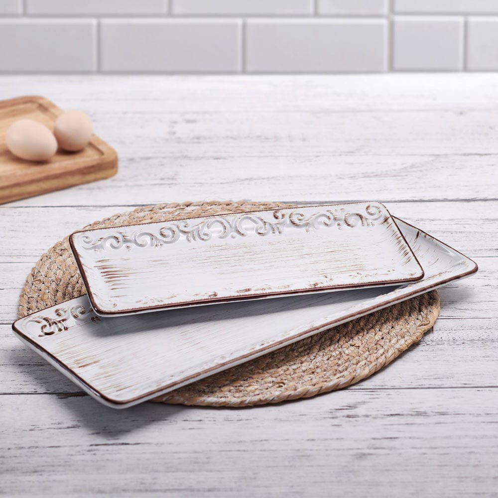 Close-up of Trellis White set of two decorative stoneware platters with embossed design