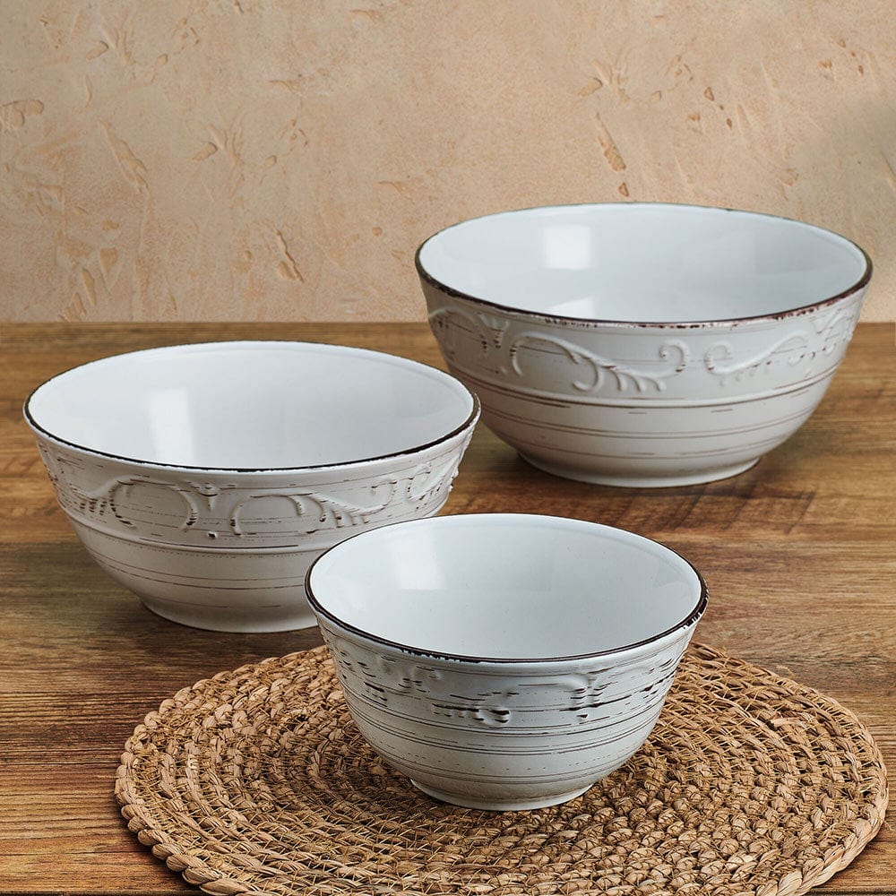 Close-up of Trellis White Stoneware Serving Bowls showing weathered design and scroll pattern