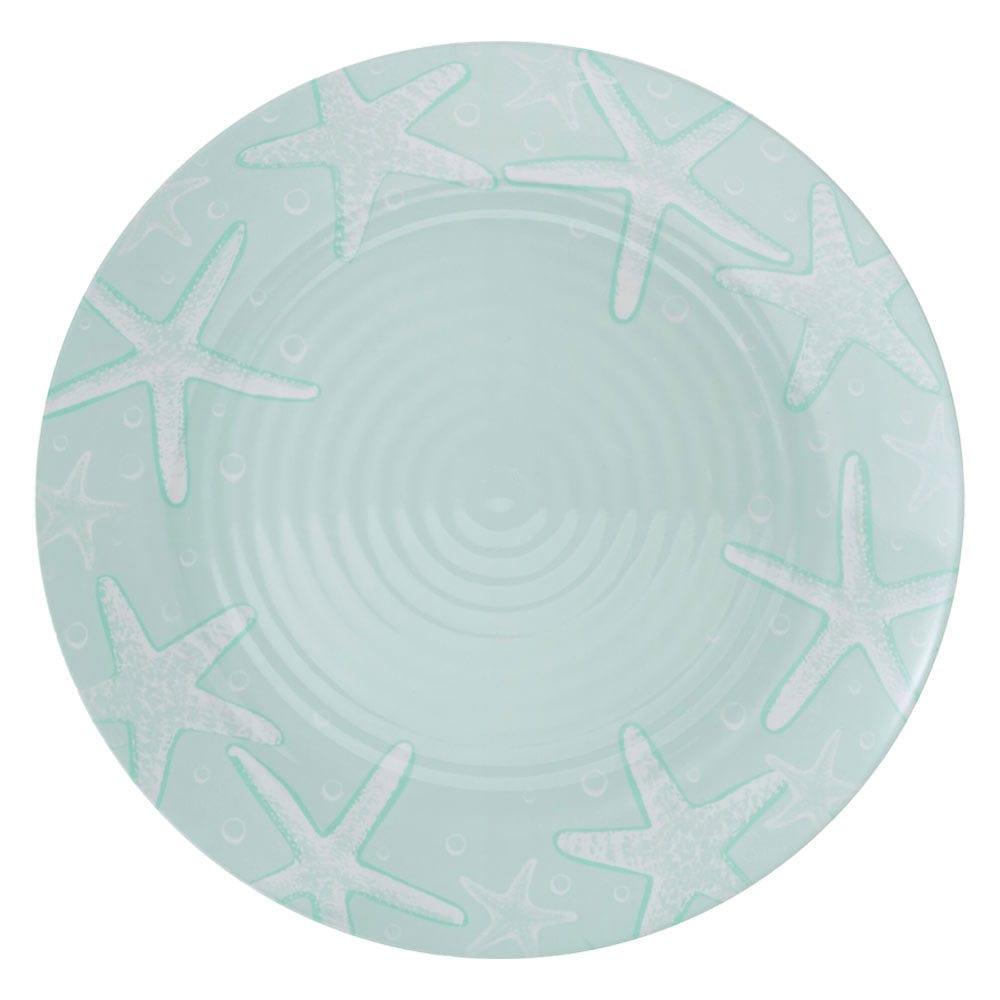 Coastal Breeze outdoor melamine dinnerware set displayed on a picnic table with vibrant starfish and seashell patterns.