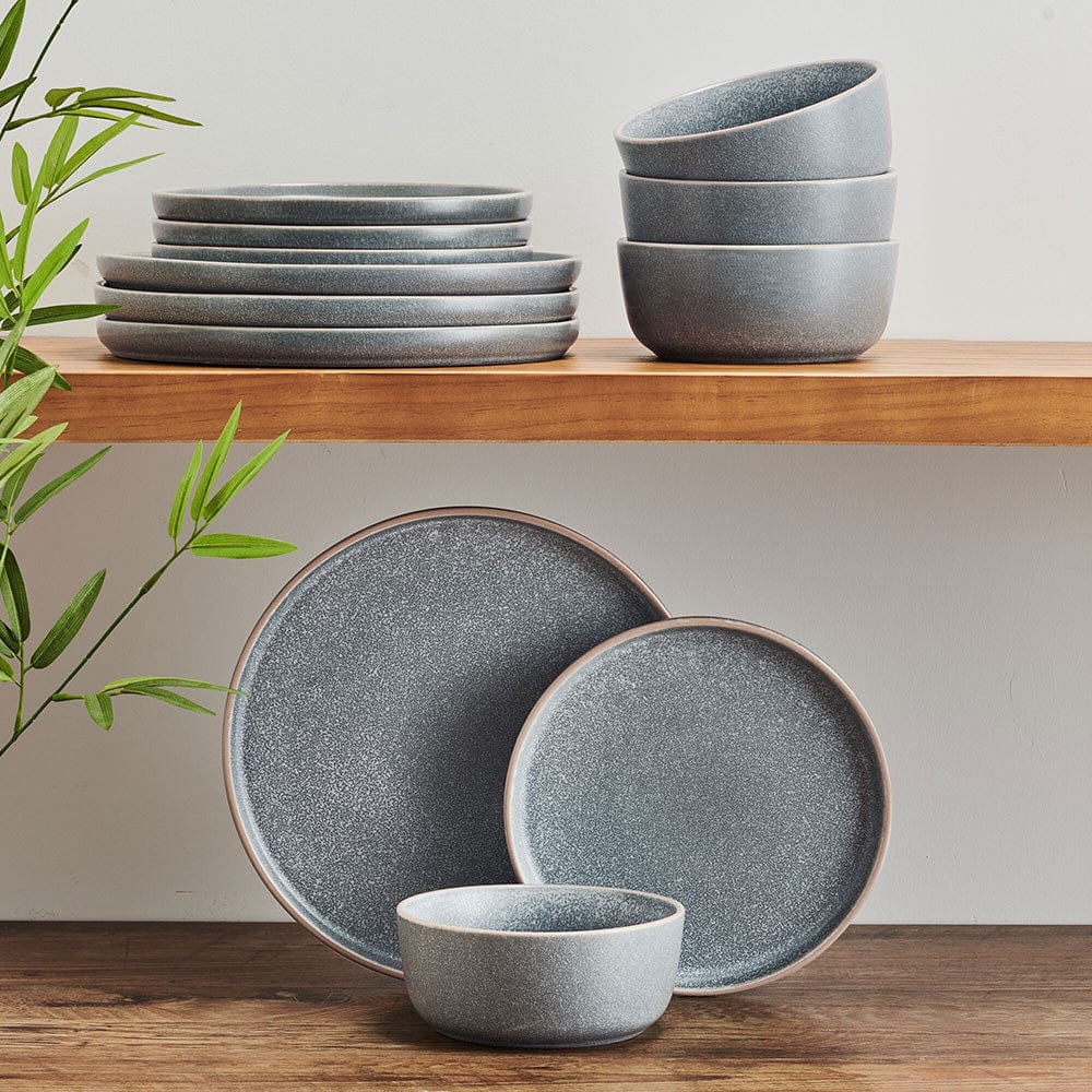 Family enjoying a meal with the Victoria dinnerware set with reactive glaze in a cozy kitchen