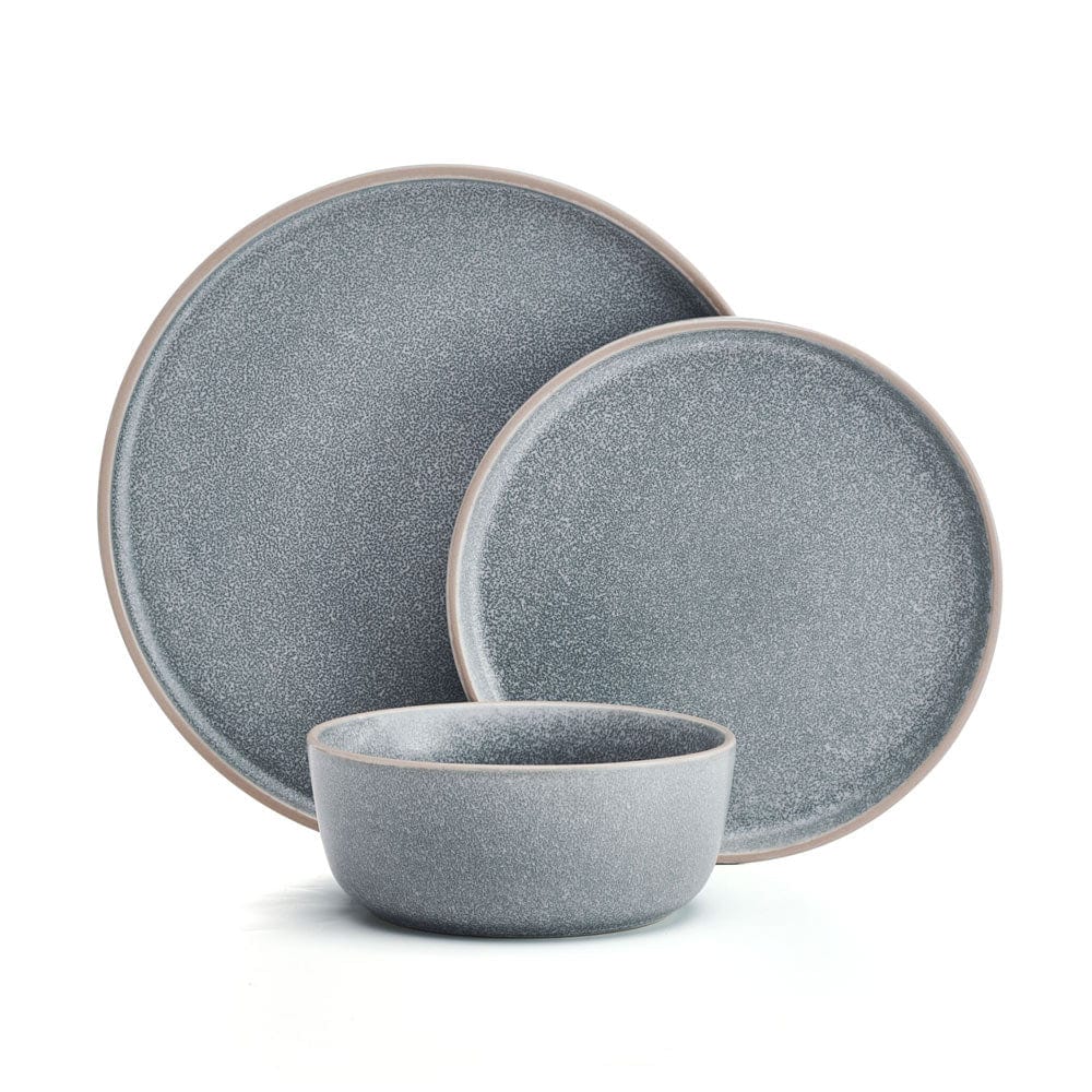 Stacked dinner plates and bowls from the Victoria 12-piece set, highlighting the handmade finish