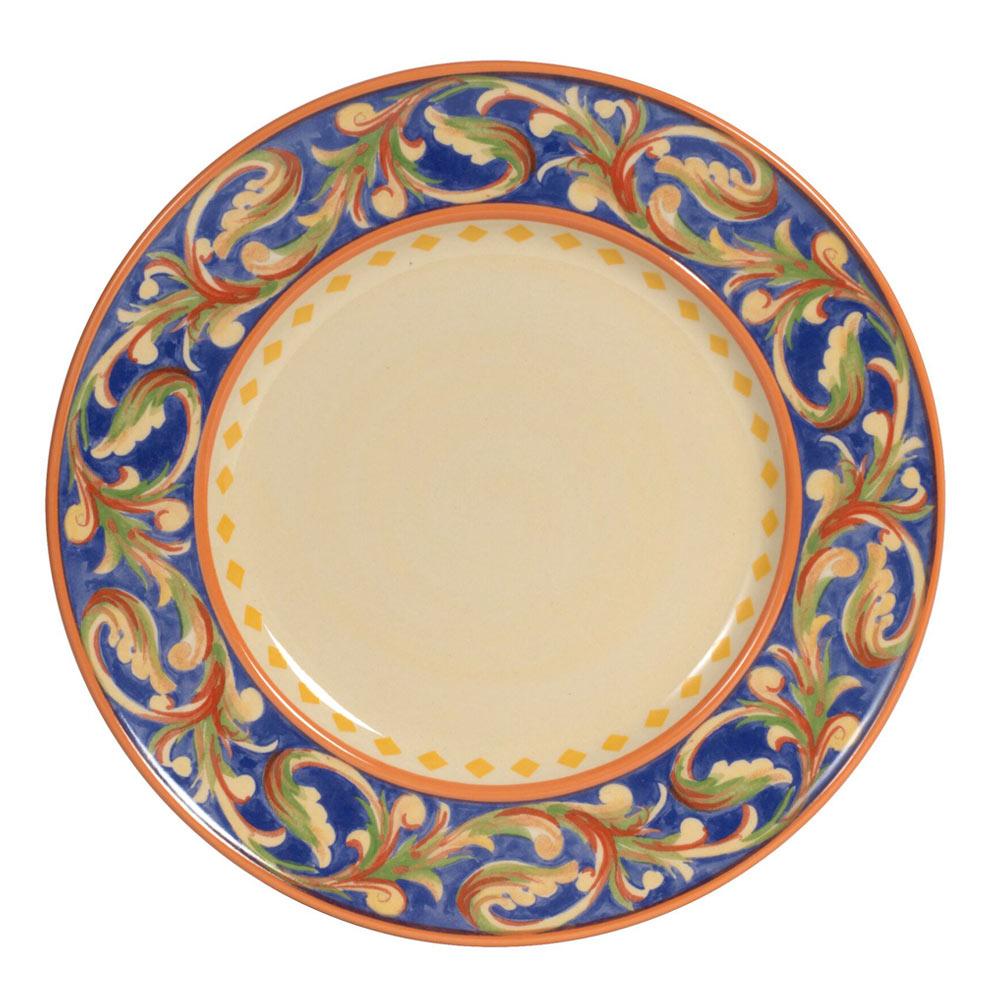 Set of blue dinnerware including salad plate, soup bowl, and coffee mug on a stylish table