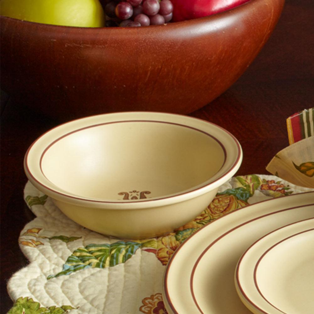 Top view of the Village stoneware bowl filled with colorful cereal and milk, showcasing its perfect size for breakfast.