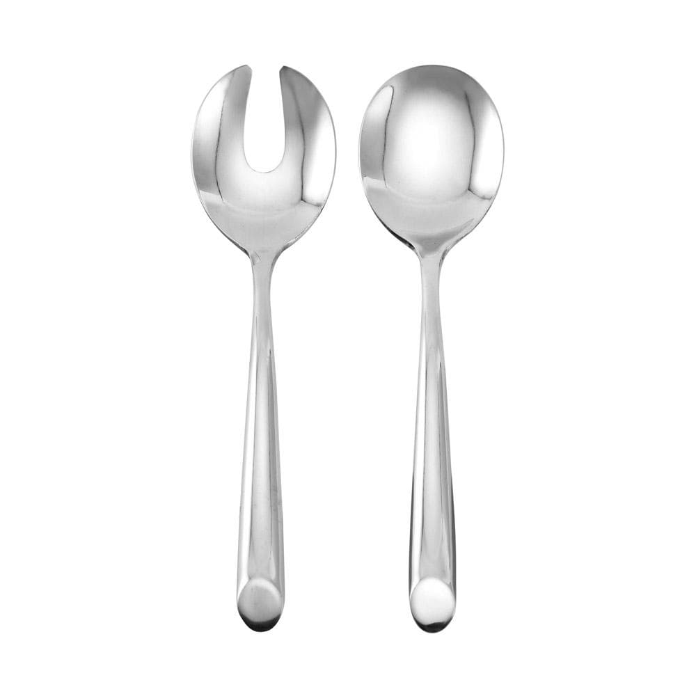 Contemporary stainless steel salad serving spoon and fork set on a dining table.