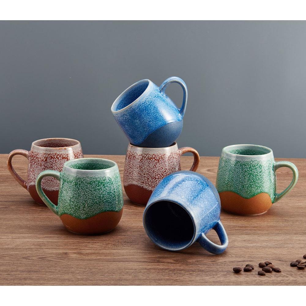 Close-up of the speckled glaze on Pfaltzgraff Wave mugs, highlighting the reactive glaze finish.
