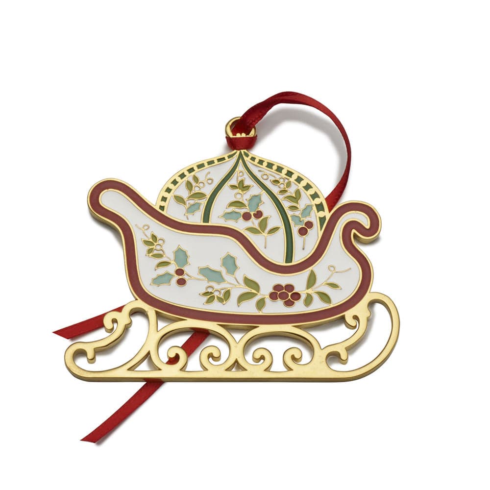 Gift presentation of the Elegant Winterberry Gold Plated Christmas Ornament in a velvet pouch with ribbon.
