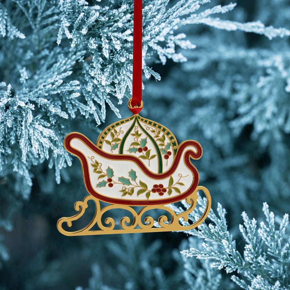 Close-up view of the Elegant Winterberry Gold Plated Christmas Ornament showcasing its beautiful enamel design.