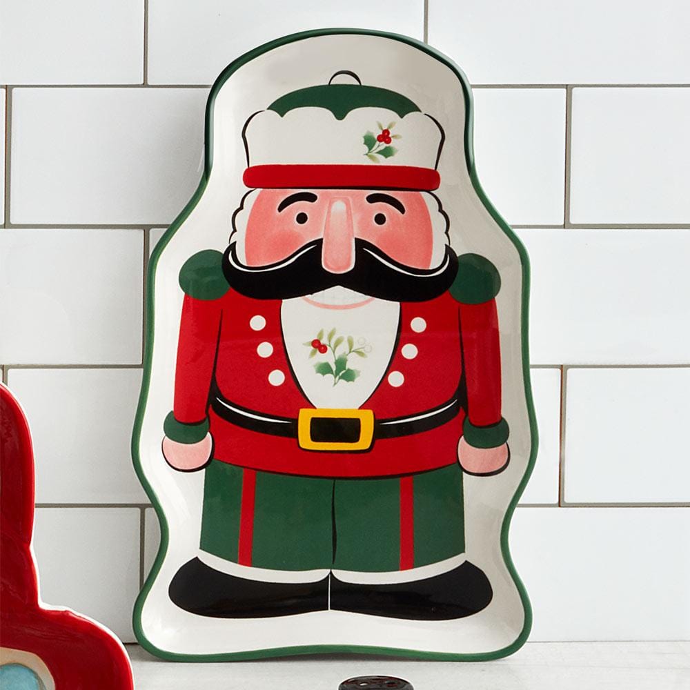 Side view of Pfaltzgraff Winterberry Nutcracker Serving Tray showcasing its festive design with holly and berries.