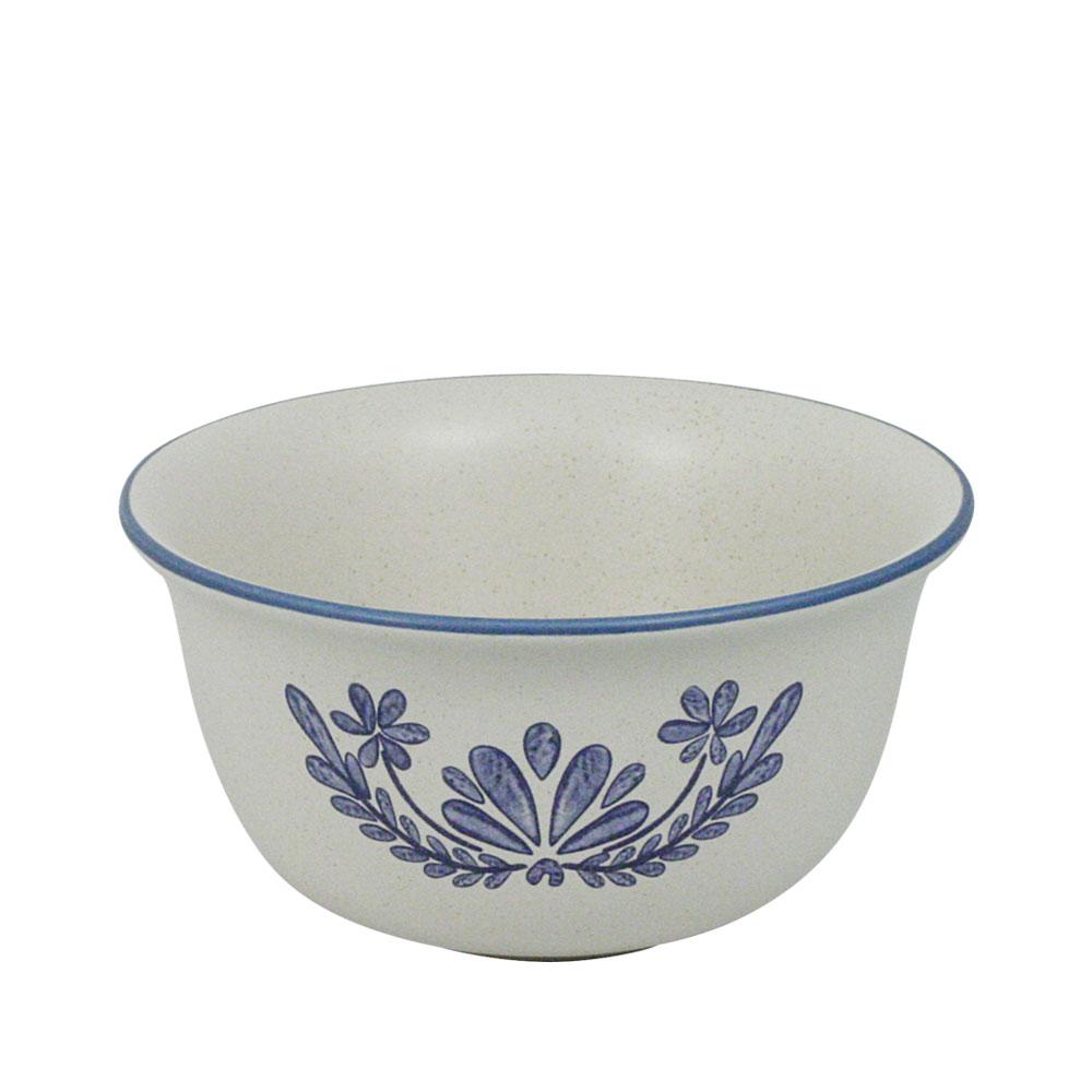 Close-up of the deep bowl filled with cereal and milk, showcasing its capacity