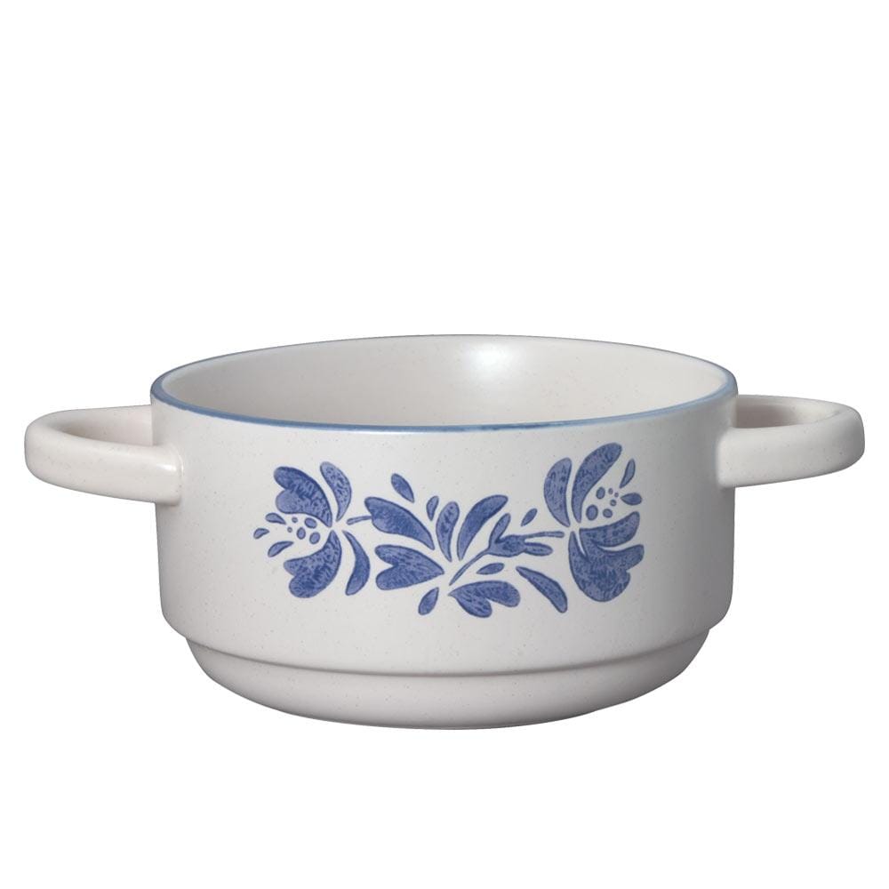 Side angle showing two-handled grip of the soup bowl with steam rising from hot stew