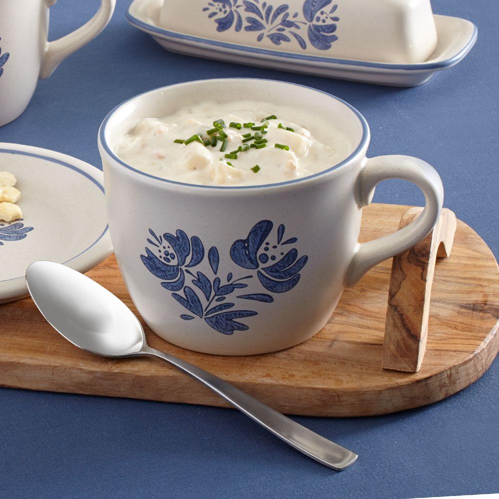 Yorktowne Extra-Large Stoneware Soup Mug filled with steaming soup on a table