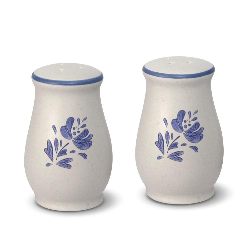 Close-up of the stoneware salt shaker, highlighting its unique shape and finish.