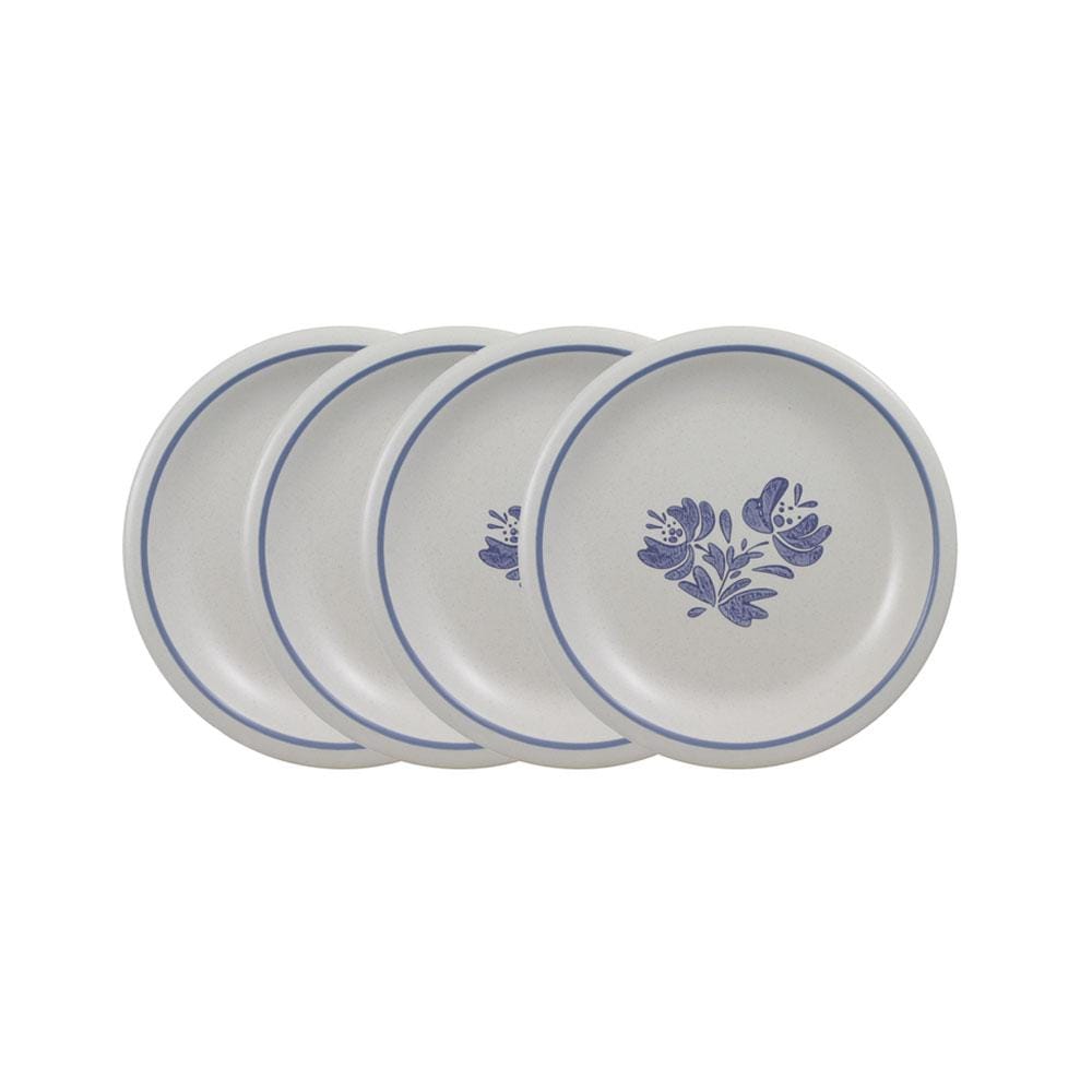 Close-up of stoneware dessert plates stacked neatly for display.